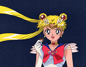Super Sailor Moon Holds Up One of Chibi Usa's Cookies